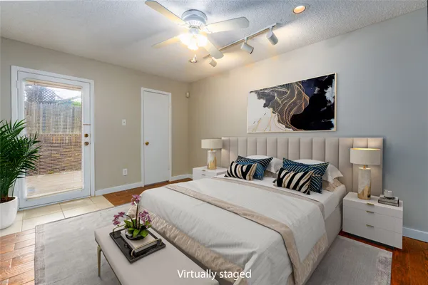 a bedroom with bed and window