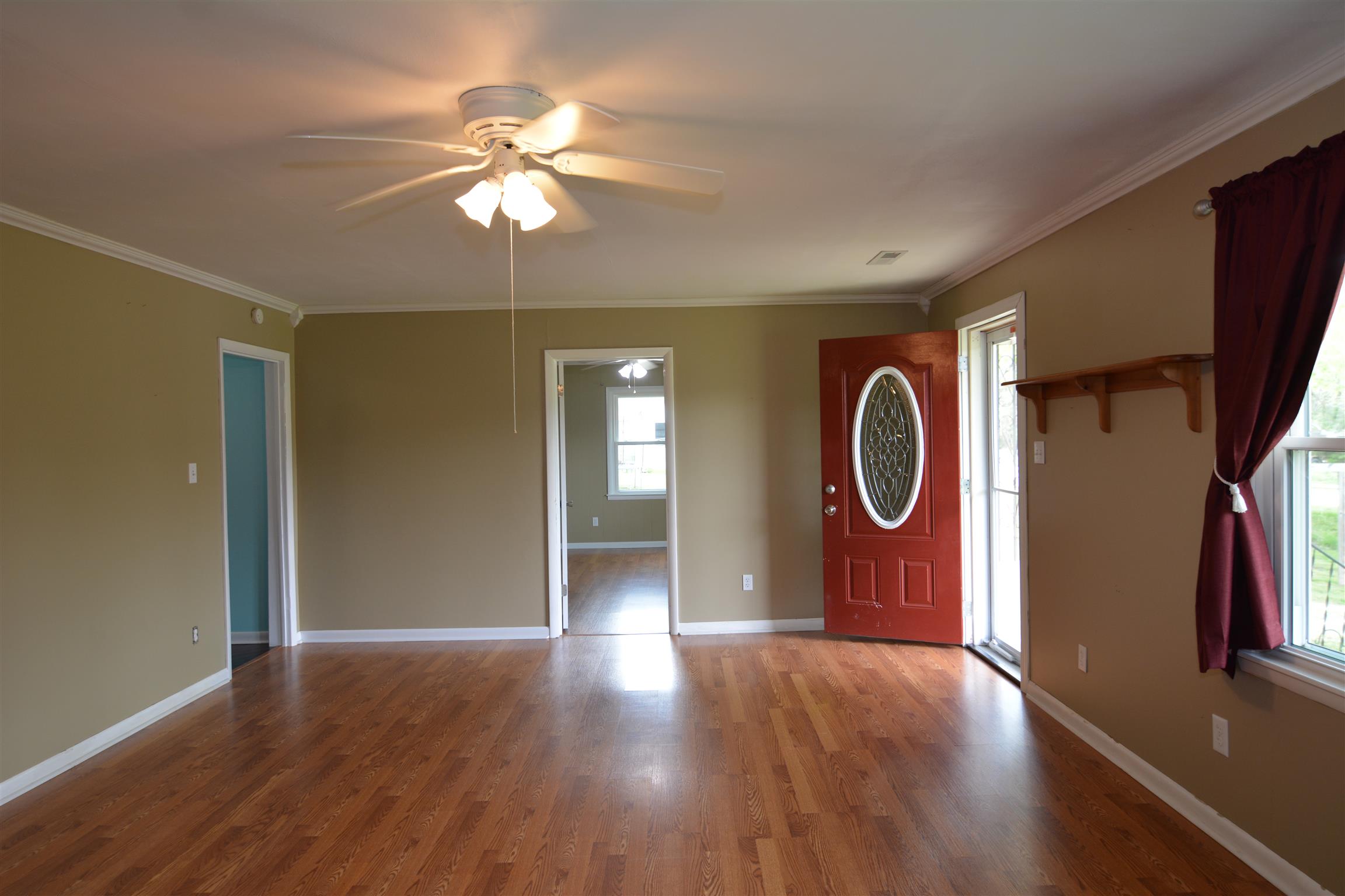 136 McBurg Road Frankewing, TN 38459 - Photo 2 of 20 Step into this beautiful farmhouse living room with hardwood floors and a fireplace.