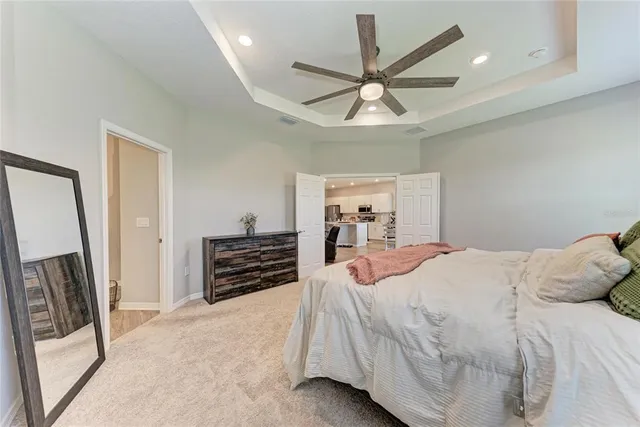 a bedroom with a workspace