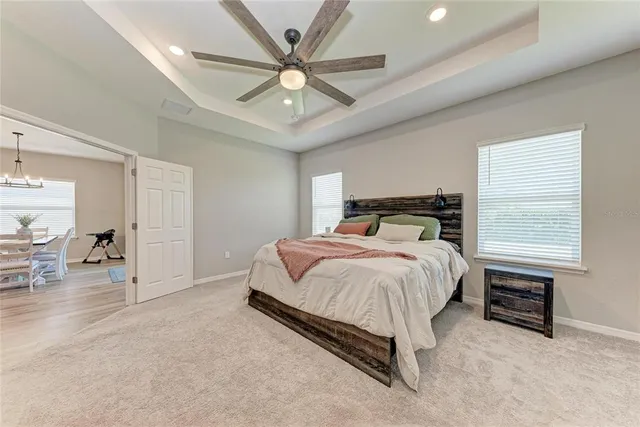 a workspace with furniture and ceiling fan