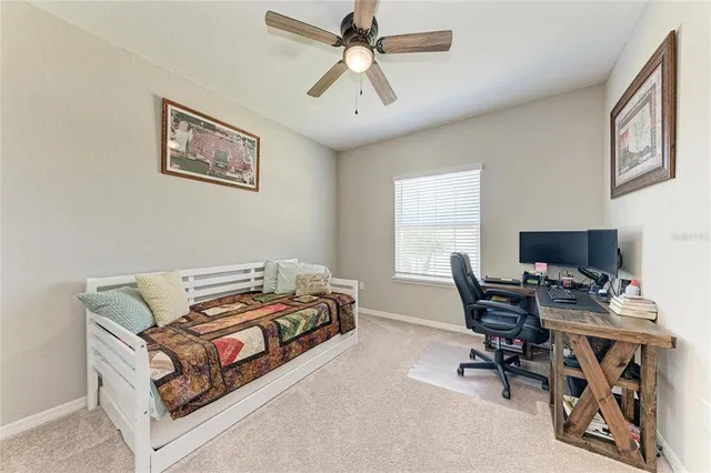 a bedroom with furniture and a window