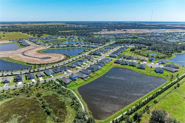 an aerial view of a house with a ocean view