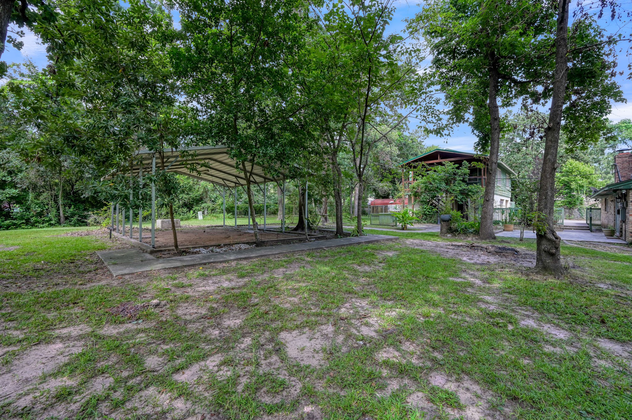2207 Arendale Lane Spring, TX 77386 - Photo 4 of 30 Covered outdoor area with views and garage apartment and of back of the home.