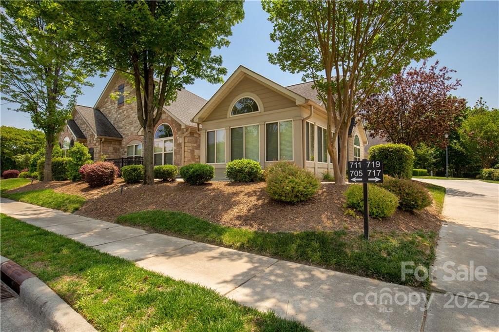 705 Ledgestone Court Tega Cay, SC 29708 - Photo 1 of 24 a front view of a house with a yard and trees