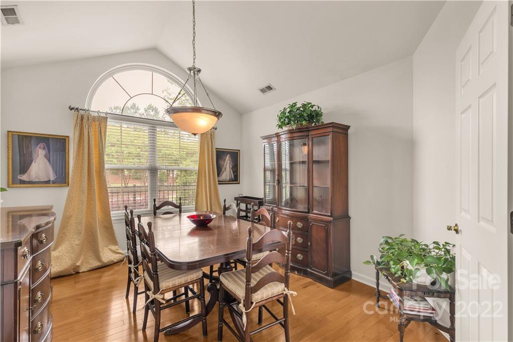 705 Ledgestone Court Tega Cay, SC 29708 - Photo 12 of 24 a view of a dining room with furniture window and outside view