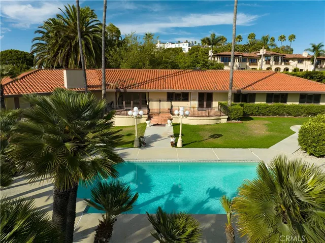 a blue swimming pool with a yard