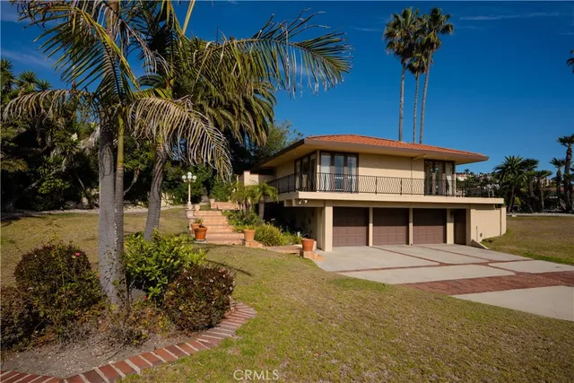 a view of staircase with railing and a window