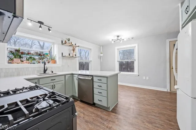 a kitchen with a stove and a window
