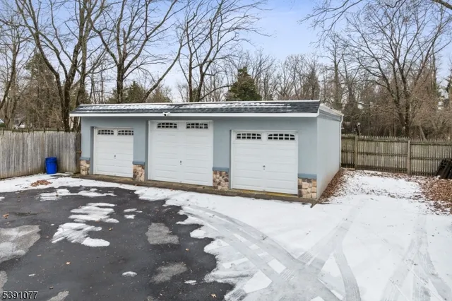 a view of a house with a snow in the backyard