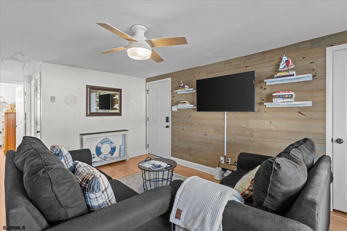 1000 West Brigantine Avenue, Unit 4 Brigantine, NJ 08203 - Photo 14 of 35 a living room with furniture and a flat screen tv