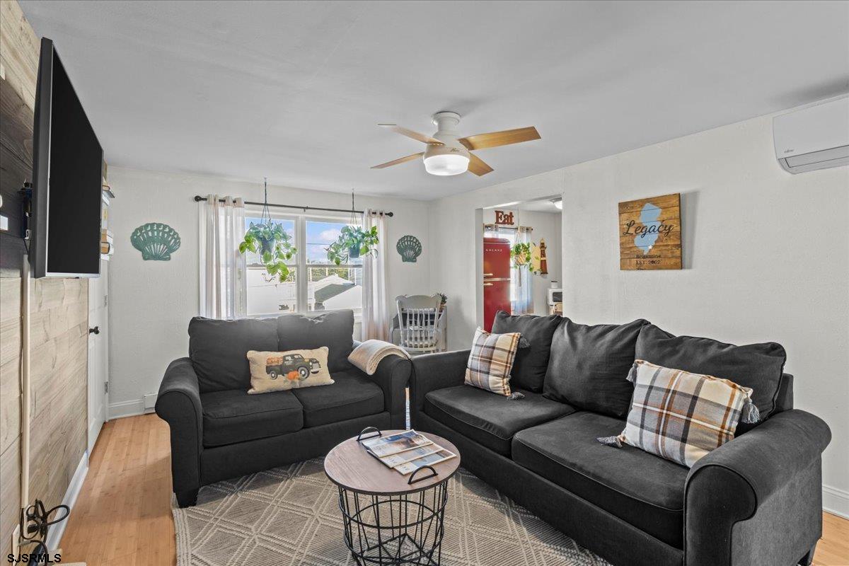 1000 West Brigantine Avenue, Unit 4 Brigantine, NJ 08203 - Photo 15 of 35 a living room with furniture and a flat screen tv