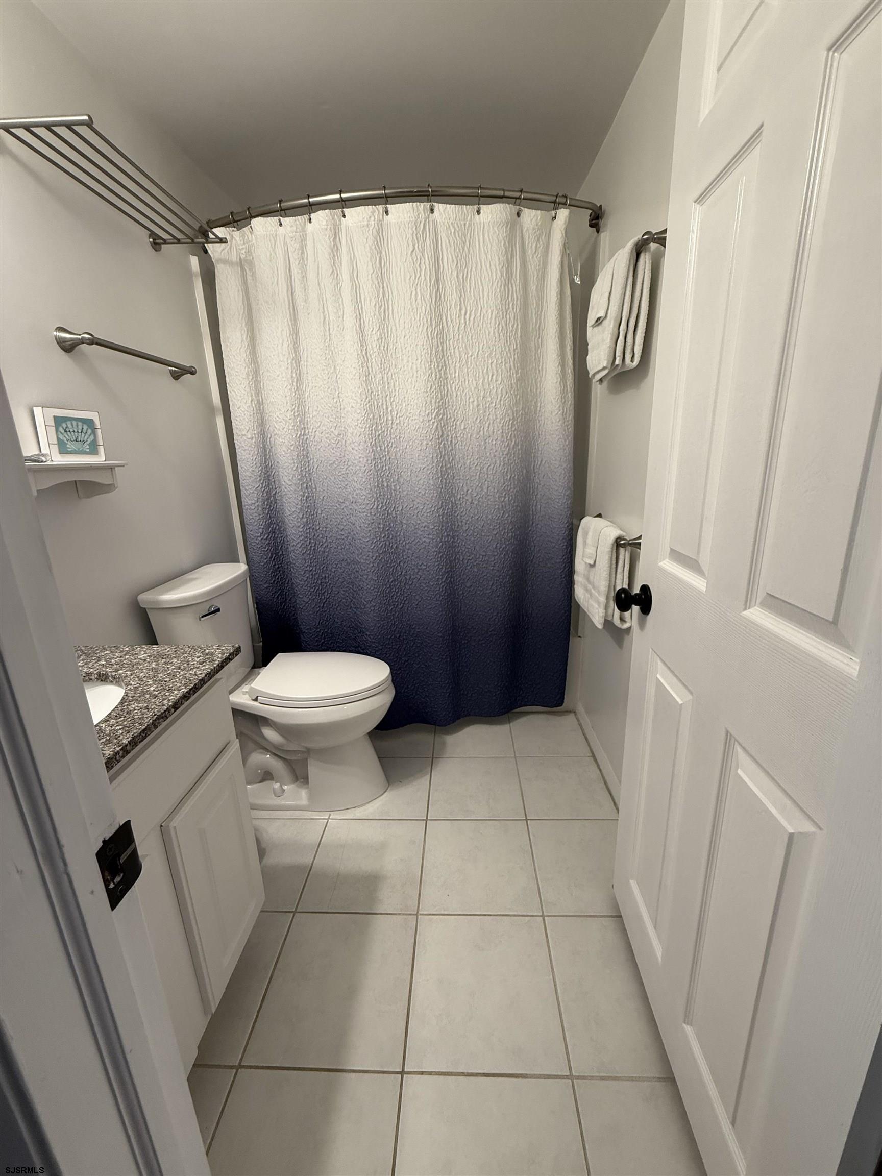 1000 West Brigantine Avenue, Unit 4 Brigantine, NJ 08203 - Photo 22 of 35 a bathroom with a sink and a toilet