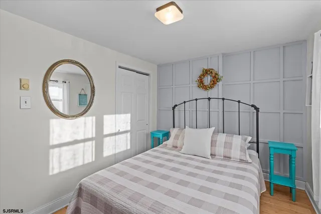 a kitchen with a sink a stove and white cabinets