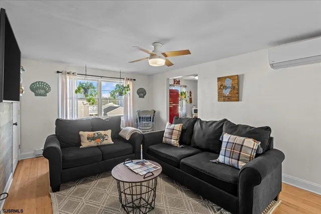 a kitchen with a sink a stove and white cabinets