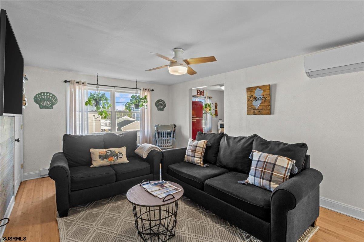 1000 West Brigantine Avenue, Unit 4 Brigantine, NJ 08203 - Photo 5 of 35 a living room with furniture and a large window