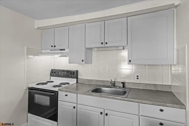 a dining room with furniture and a window