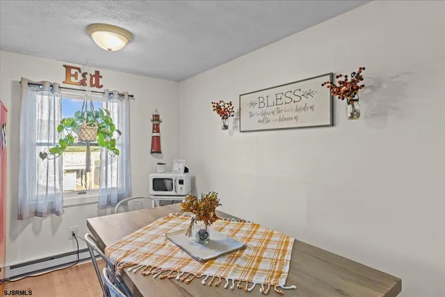 a view of kitchen with furniture and natural light