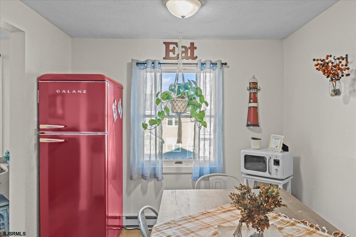 1000 West Brigantine Avenue, Unit 4 Brigantine, NJ 08203 - Photo 9 of 35 a view of kitchen with furniture and natural light