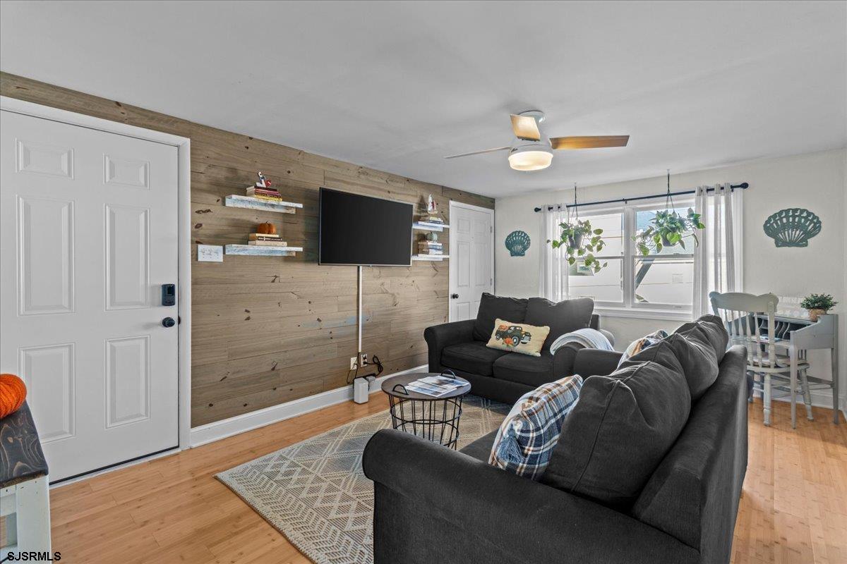 1000 West Brigantine Avenue, Unit 4 Brigantine, NJ 08203 - Photo 10 of 35 a living room with furniture and a flat screen tv