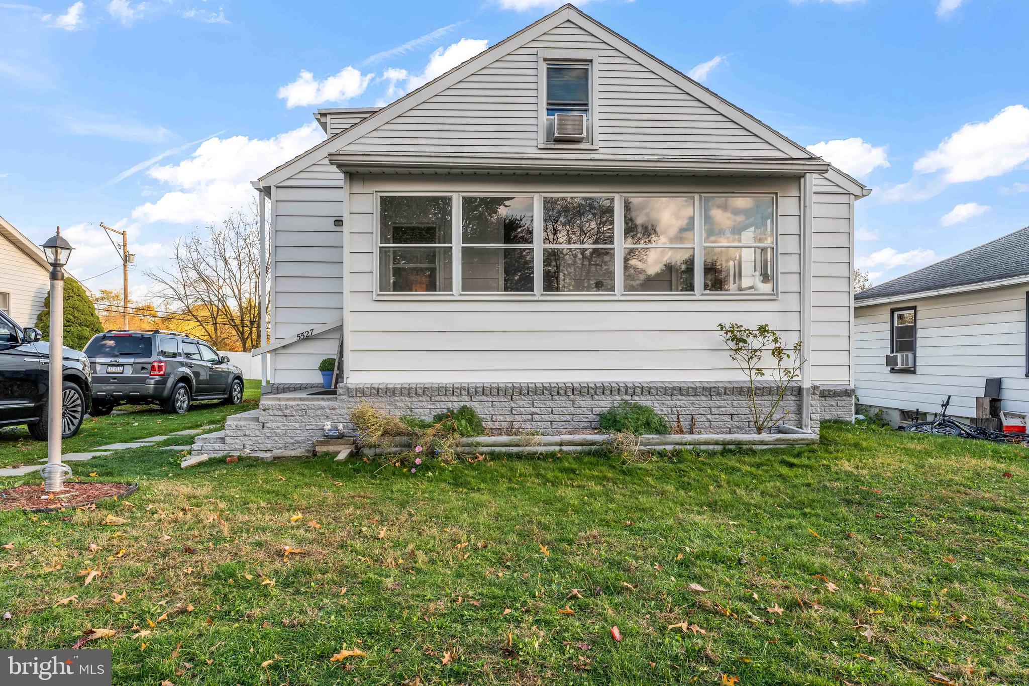5527 Locust Street Harrisburg, PA 17112 - Photo 1 of 14 a front view of house with a garden
