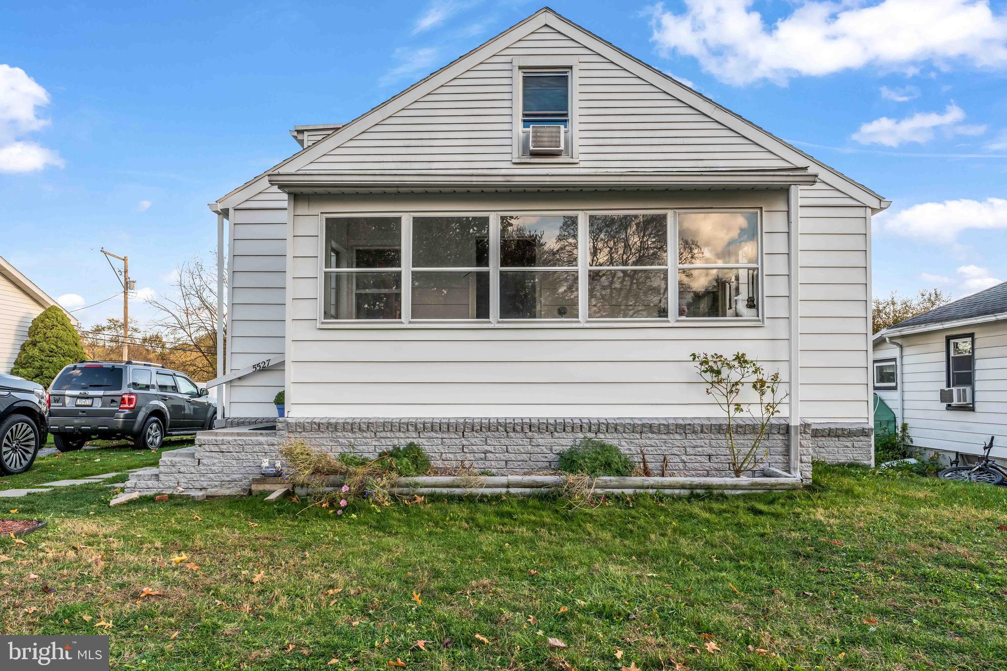 5527 Locust Street Harrisburg, PA 17112 - Photo 2 of 14 a front view of a house with a yard
