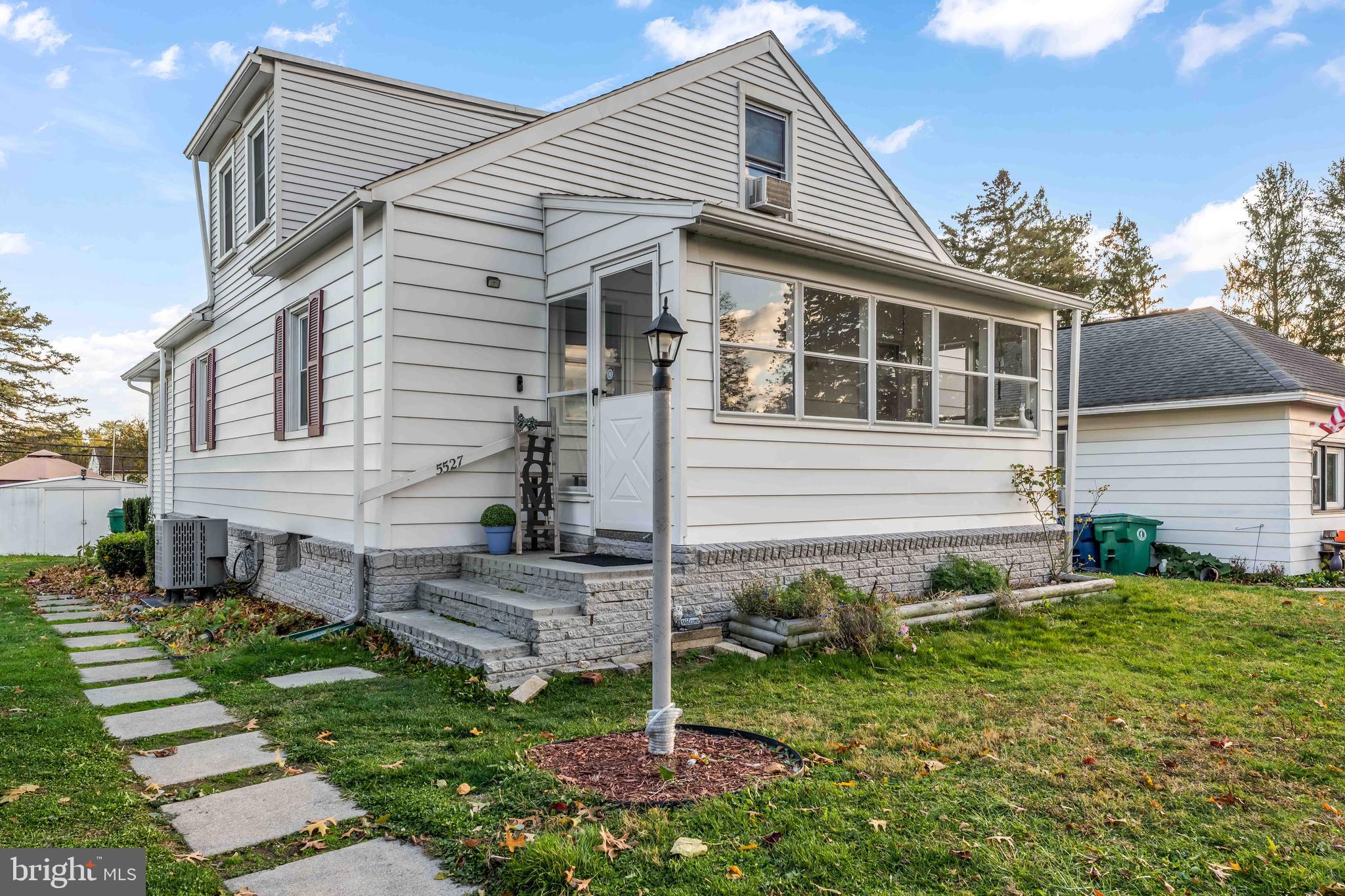 5527 Locust Street Harrisburg, PA 17112 - Photo 3 of 14 a front view of a house with a yard