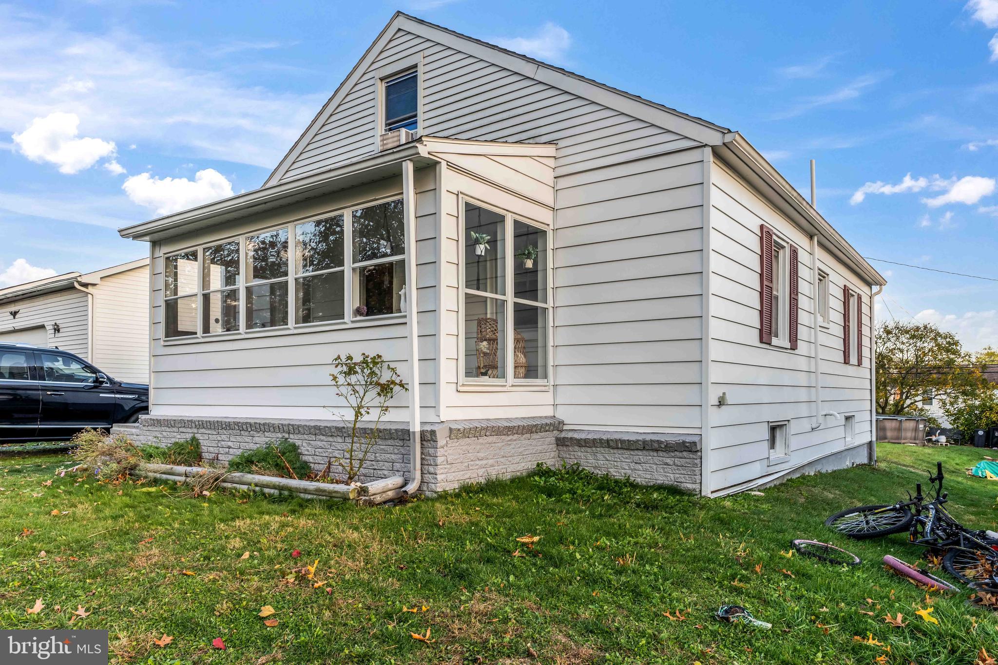 5527 Locust Street Harrisburg, PA 17112 - Photo 4 of 14 a front view of a house with a yard
