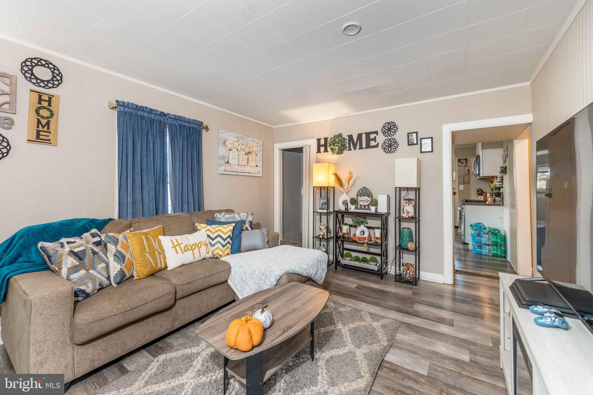 5527 Locust Street Harrisburg, PA 17112 - Photo 7 of 14 a living room with furniture and wooden floor