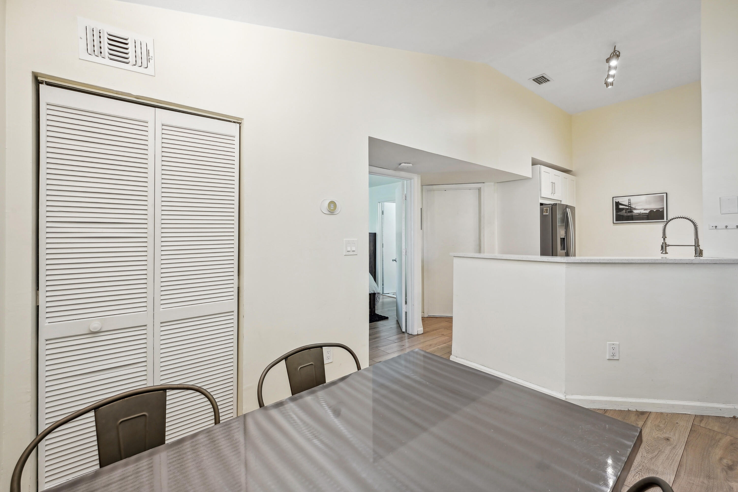 1050 Crystal Way, Unit L Delray Beach, FL 33444 - Photo 25 of 34 a bathroom with a sink and a mirror