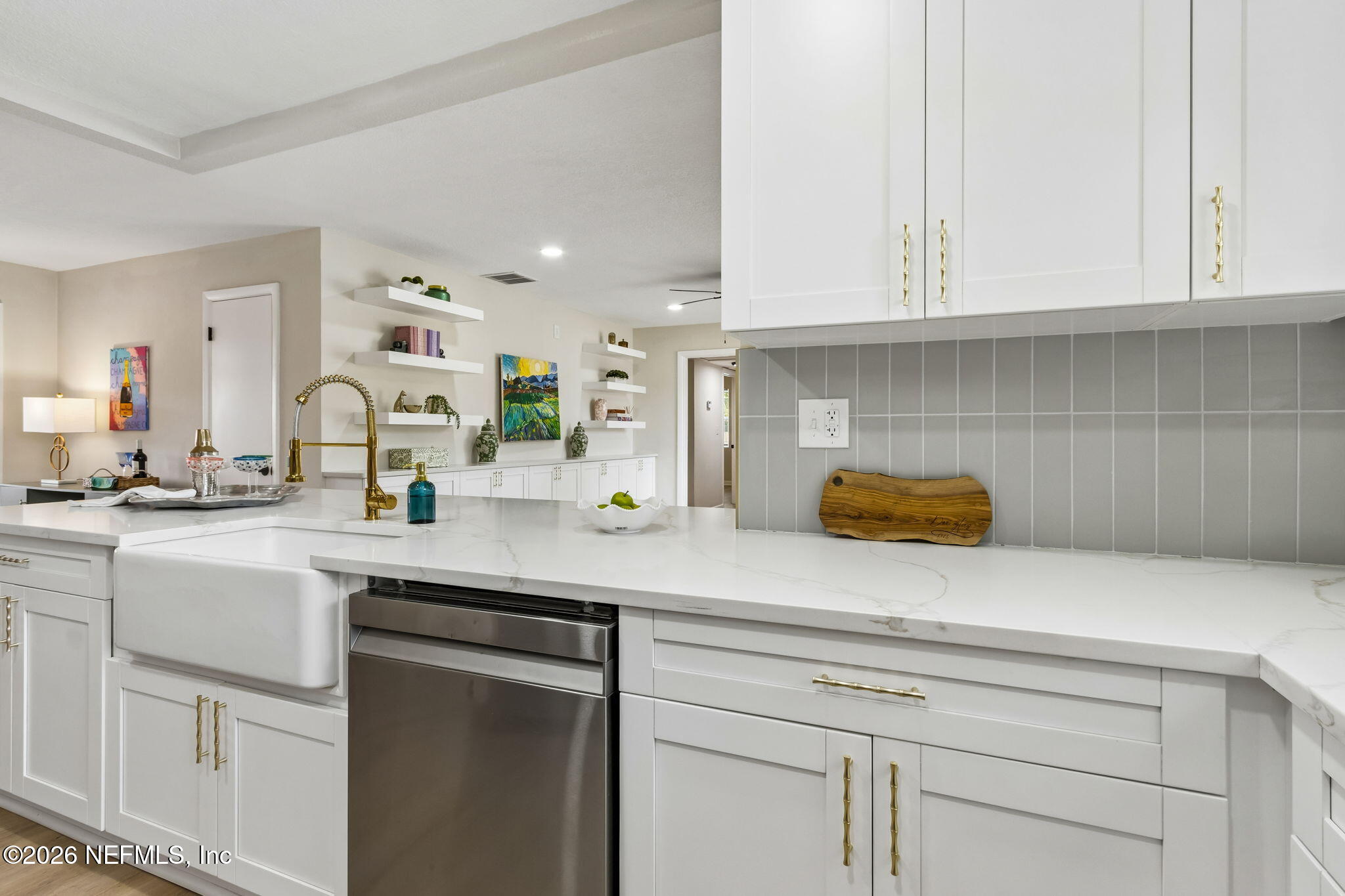3668 Marianna Road Jacksonville, FL 32217 - Photo 10 of 28 a kitchen with white cabinets and a sink