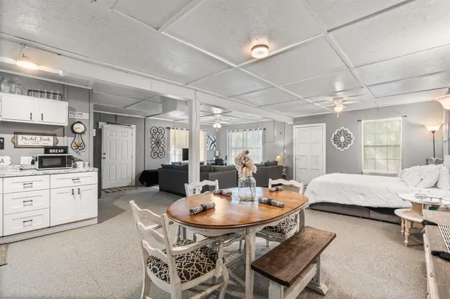 a outdoor dining room with furniture