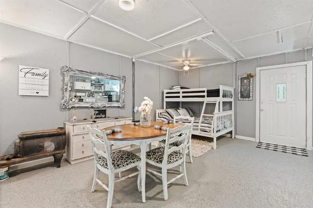 a dining room with furniture and window