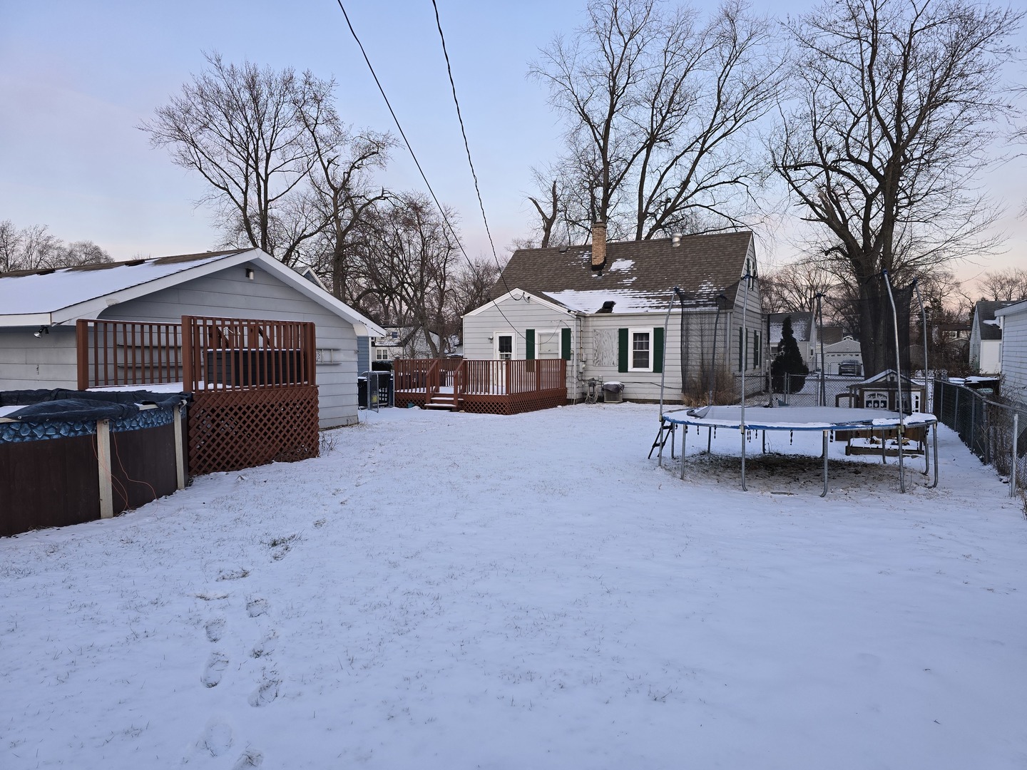 14348 Kolmar Avenue Midlothian, IL 60445 - Photo 13 of 13 a front view of a house with a yard and garage