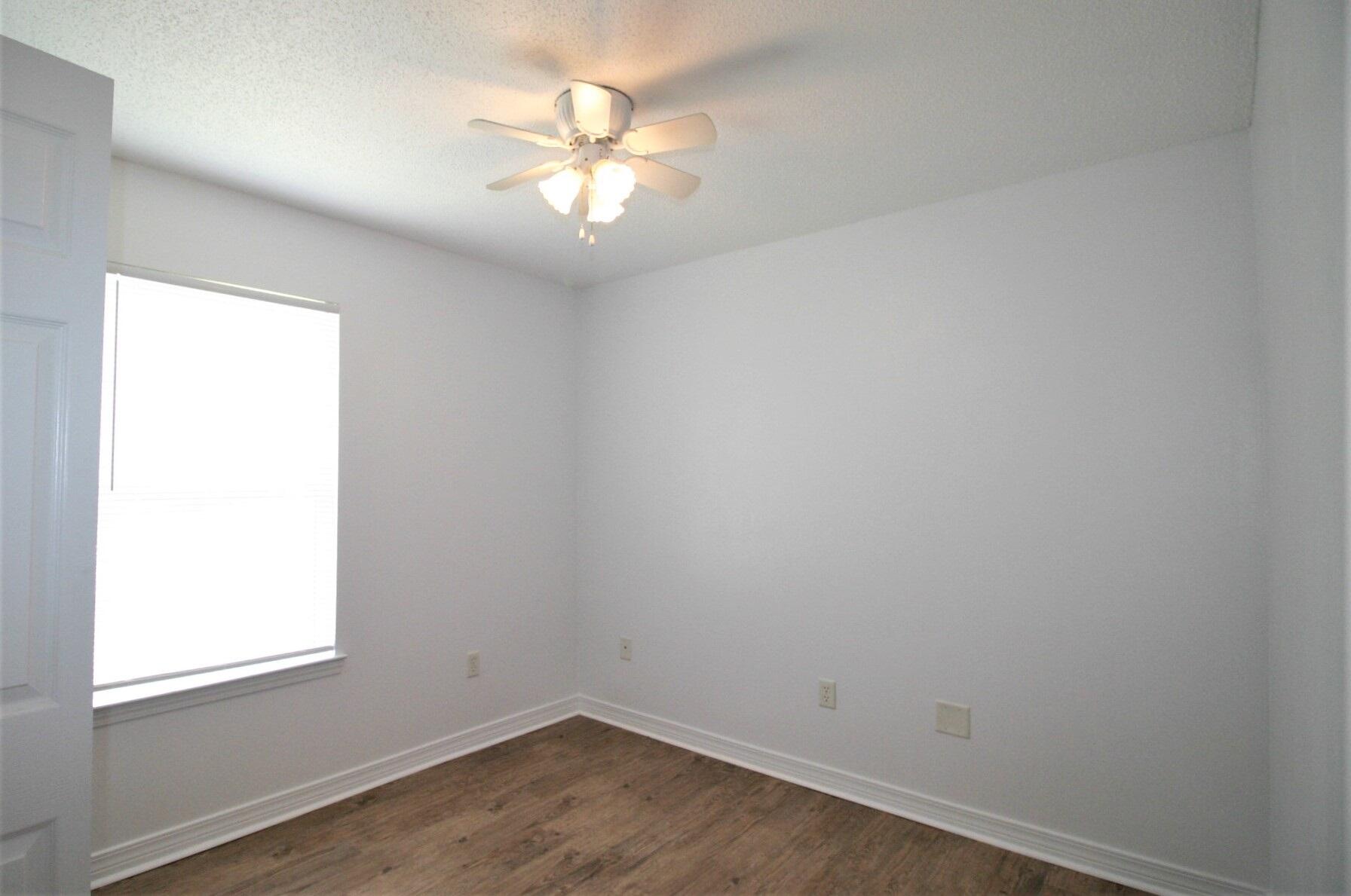 552 Brock Avenue Crestview, FL 32539 - Photo 11 of 13 an empty room with a window