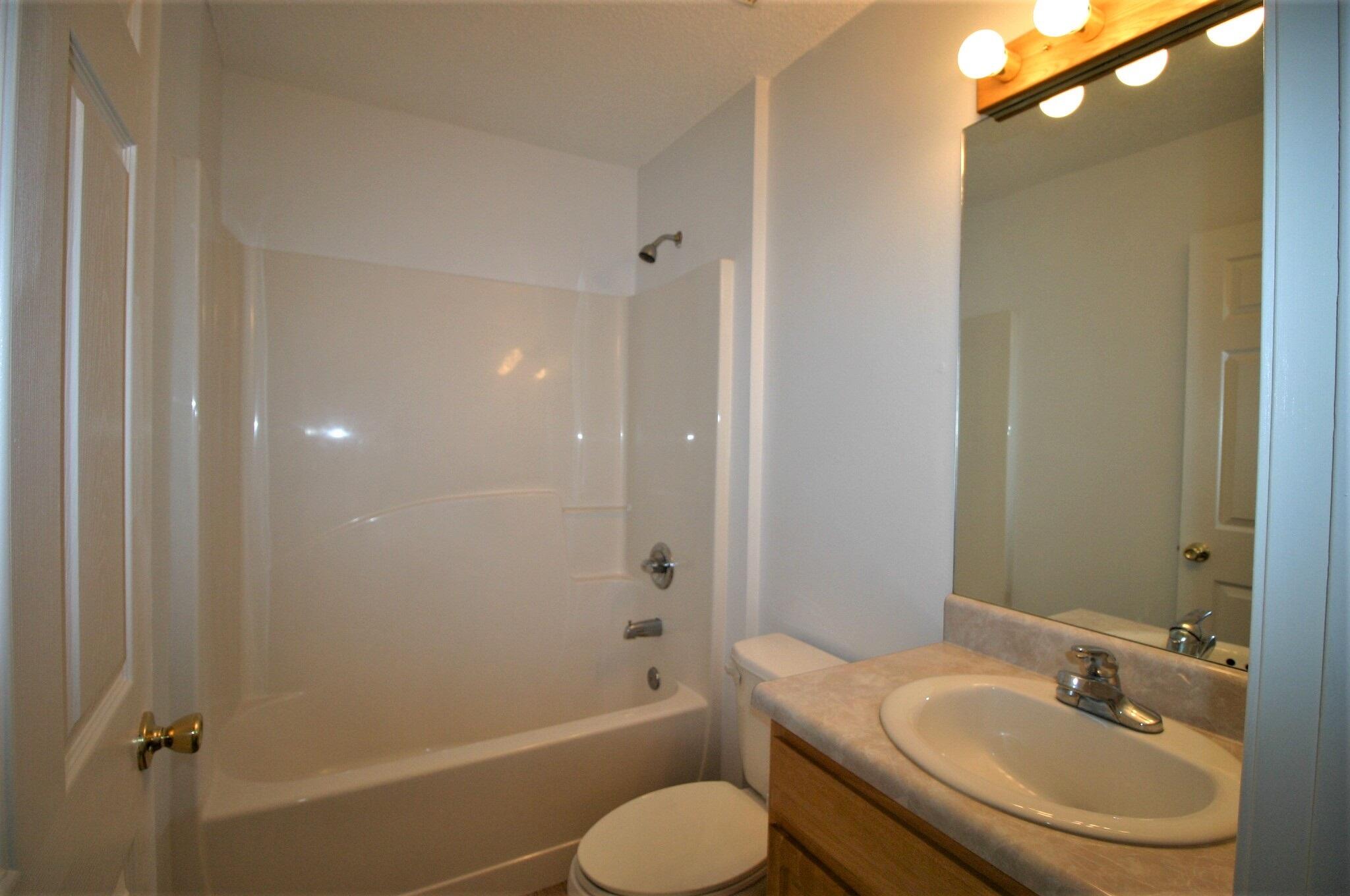 552 Brock Avenue Crestview, FL 32539 - Photo 12 of 13 a bathroom with a sink toilet and shower