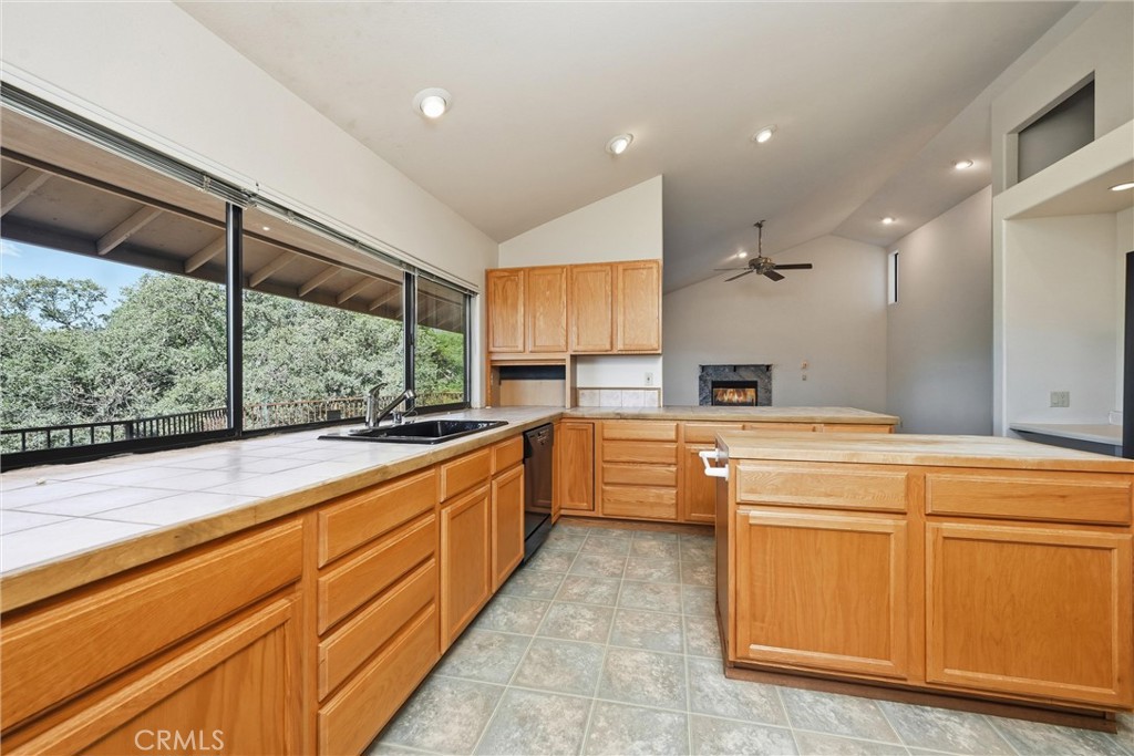 16261 Conestoga Road Hidden Valley Lake, CA 95467 - Photo 11 of 64 a large kitchen with stainless steel appliances granite countertop a sink and cabinets