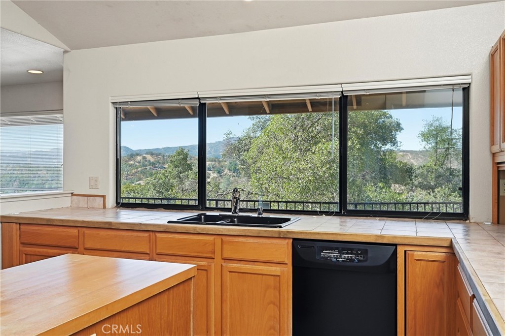 16261 Conestoga Road Hidden Valley Lake, CA 95467 - Photo 16 of 64 a view of a kitchen with a sink and large window