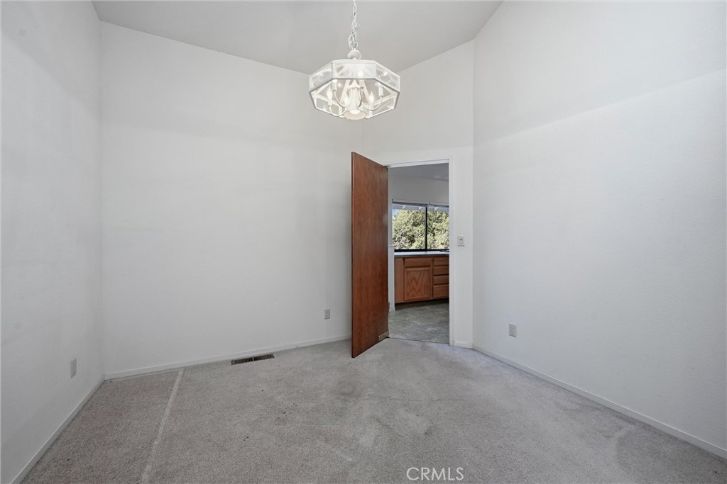 16261 Conestoga Road Hidden Valley Lake, CA 95467 - Photo 18 of 64 a view of an empty room and a bathroom with sink