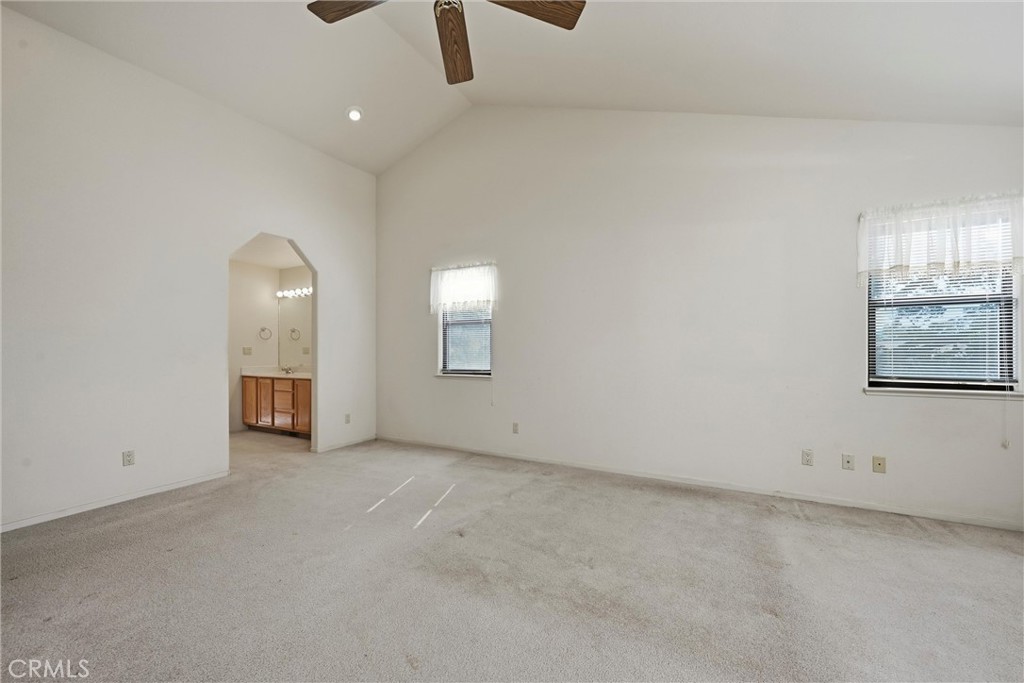 16261 Conestoga Road Hidden Valley Lake, CA 95467 - Photo 21 of 64 an empty room with windows and fan