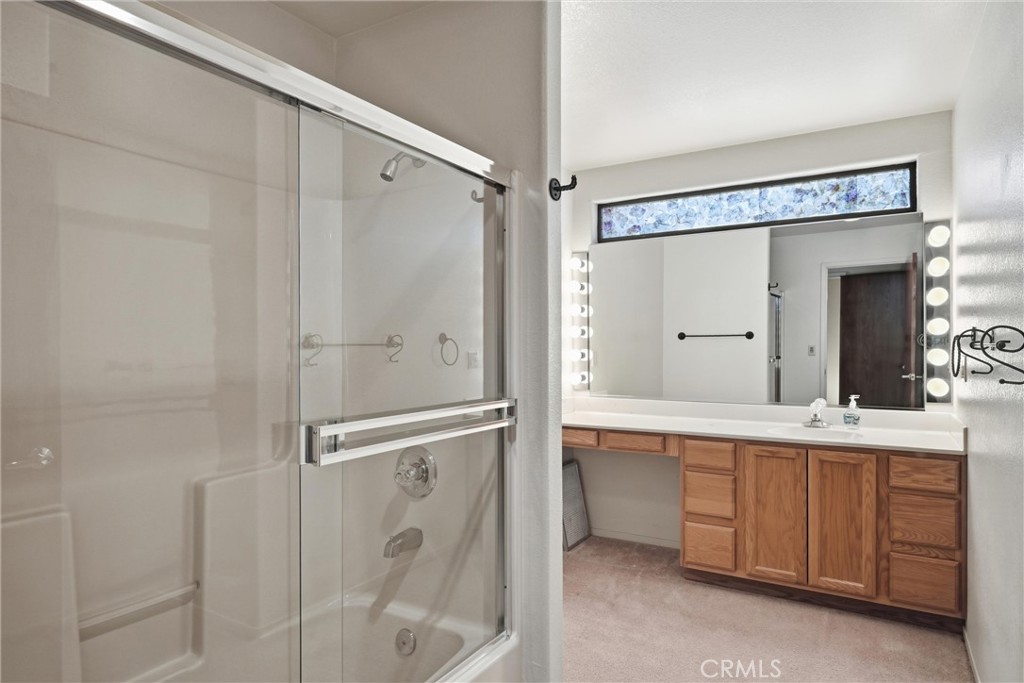 16261 Conestoga Road Hidden Valley Lake, CA 95467 - Photo 28 of 64 a bathroom with a double vanity sink mirror and shower