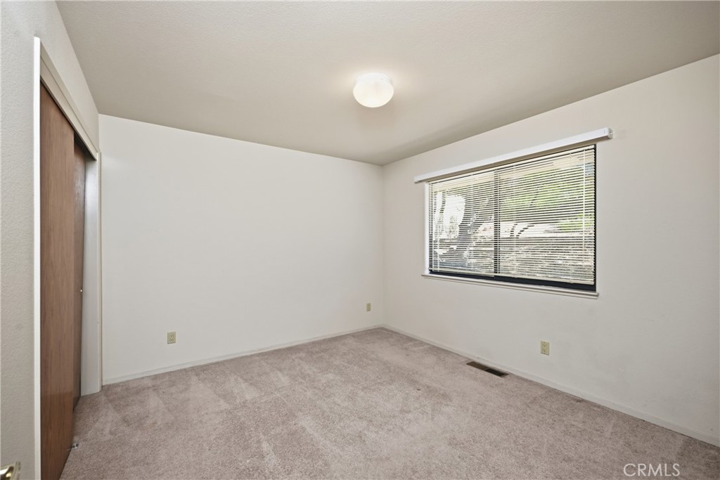 16261 Conestoga Road Hidden Valley Lake, CA 95467 - Photo 30 of 64 an empty room with windows