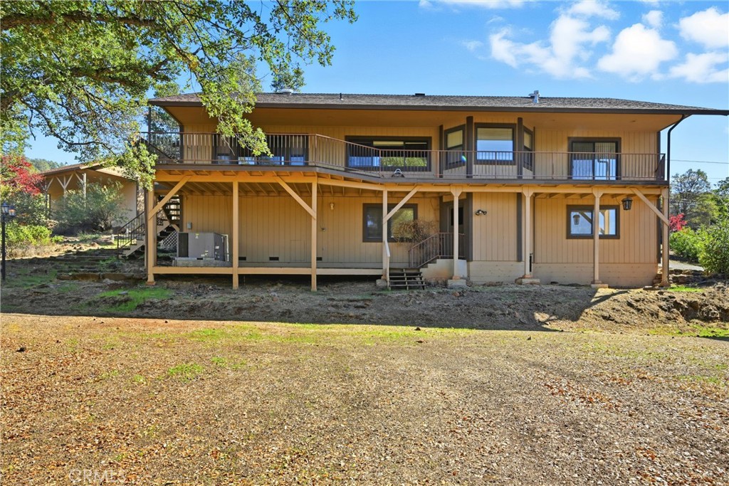 16261 Conestoga Road Hidden Valley Lake, CA 95467 - Photo 3 of 64 a front view of a house with garden