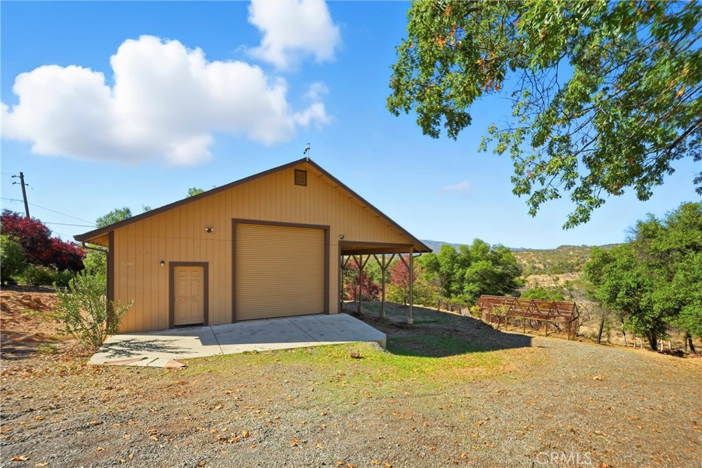 16261 Conestoga Road Hidden Valley Lake, CA 95467 - Photo 41 of 64 a view of an house with backyard and garden