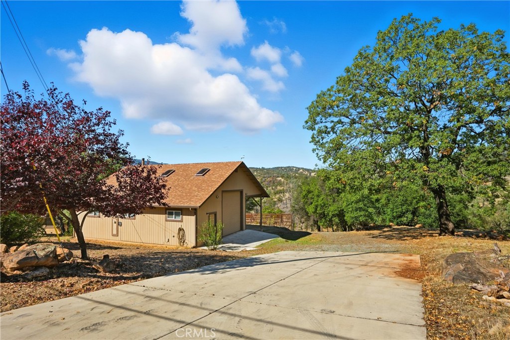 16261 Conestoga Road Hidden Valley Lake, CA 95467 - Photo 42 of 64 a view of a house with a yard