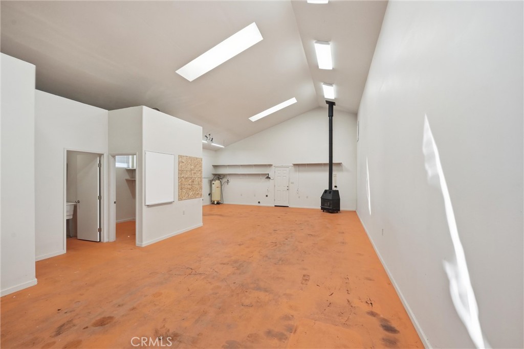 16261 Conestoga Road Hidden Valley Lake, CA 95467 - Photo 44 of 64 a bedroom with a bed and a chandelier