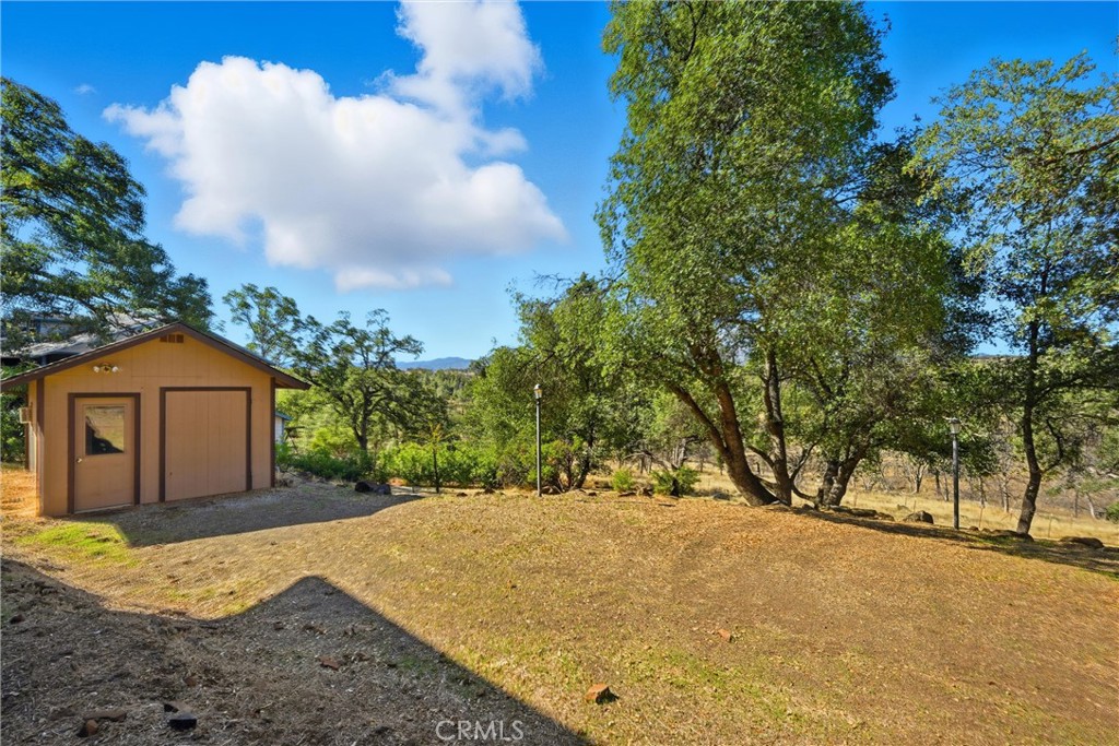 16261 Conestoga Road Hidden Valley Lake, CA 95467 - Photo 50 of 64 a view of a backyard of the house