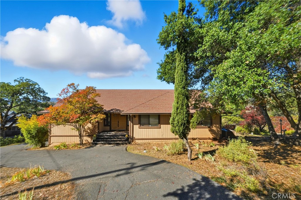 16261 Conestoga Road Hidden Valley Lake, CA 95467 - Photo 60 of 64 a view of a house with a tree and a yard