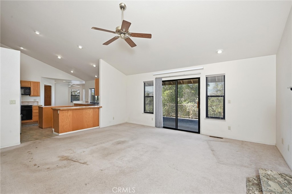 16261 Conestoga Road Hidden Valley Lake, CA 95467 - Photo 10 of 64 a view of an empty room with a window and kitchen view