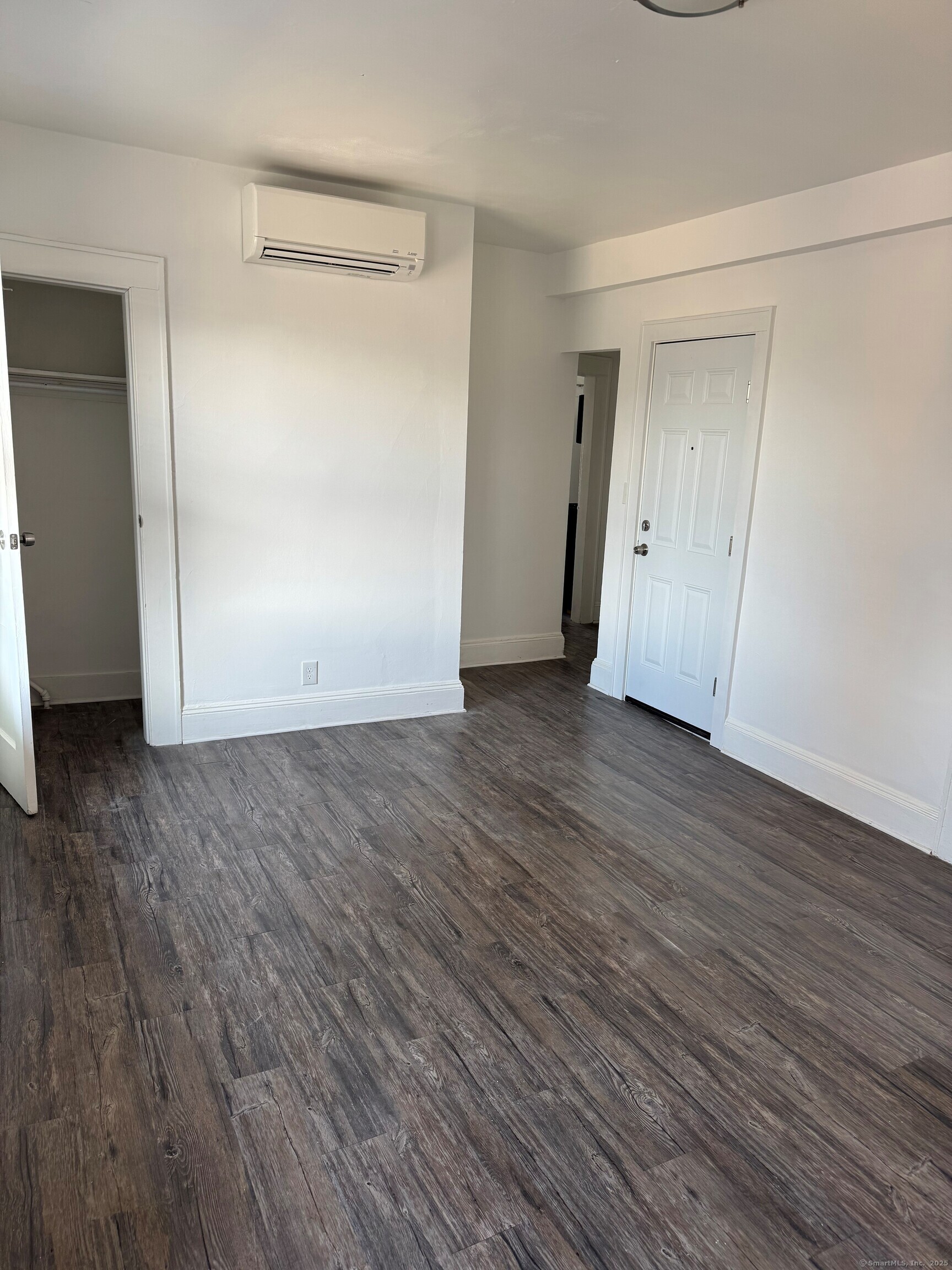 3142 Fairfield Avenue, Unit 2 Bridgeport, CT 06605 - Photo 4 of 11 a view of an empty room with wooden floor