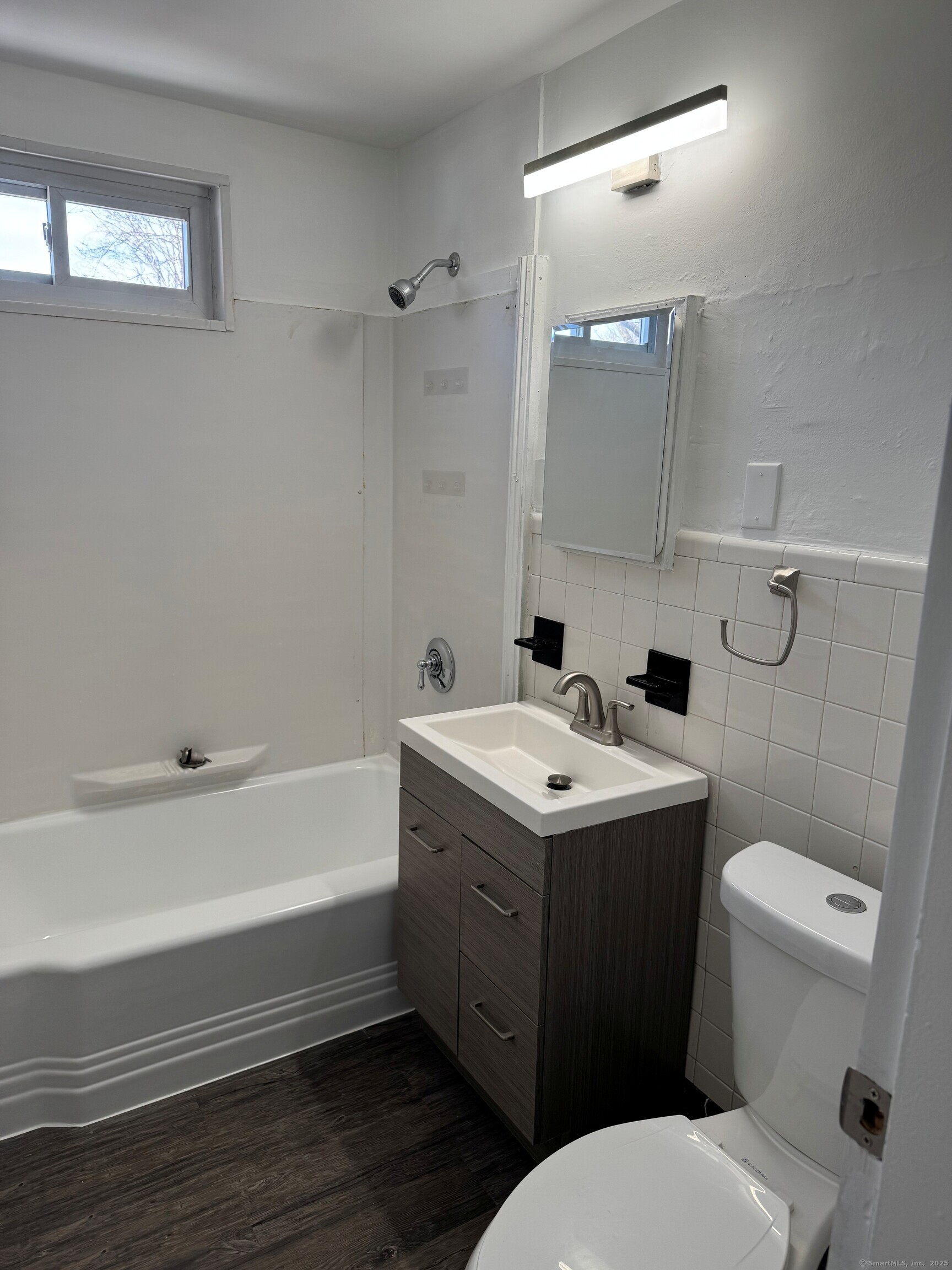 3142 Fairfield Avenue, Unit 2 Bridgeport, CT 06605 - Photo 6 of 11 a bathroom with a sink toilet and shower